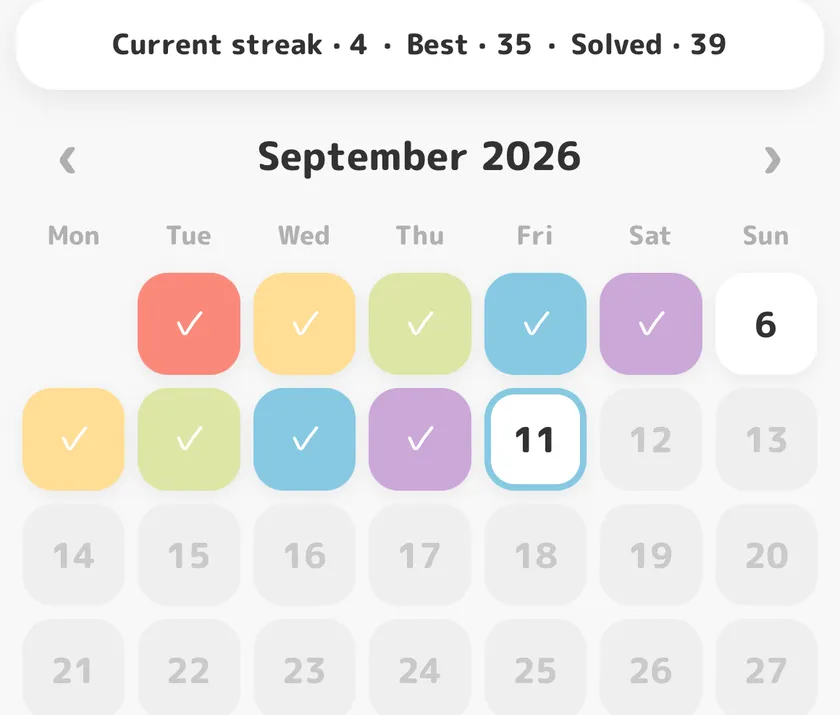 Daily Challenges calendar with solved days colored in and the current streak shown above